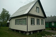 Отделка виниловым блокхаусом садового дома в Дунай